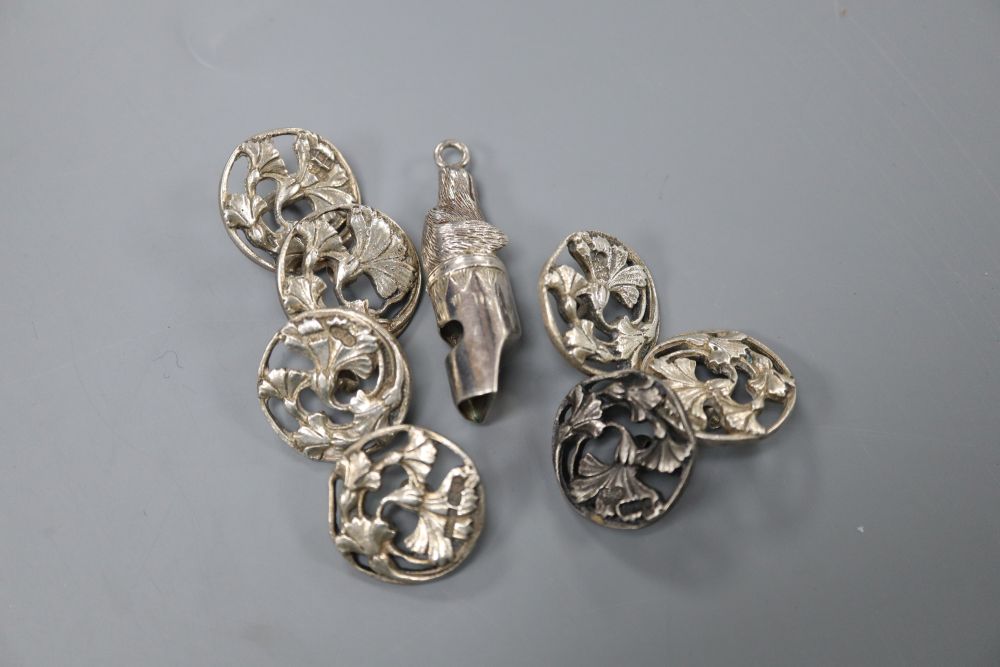 A set of seven pierced foliate silver buttons, Deakin & Francis, Birmingham, 1902 and a modern silver dogs head whistle.